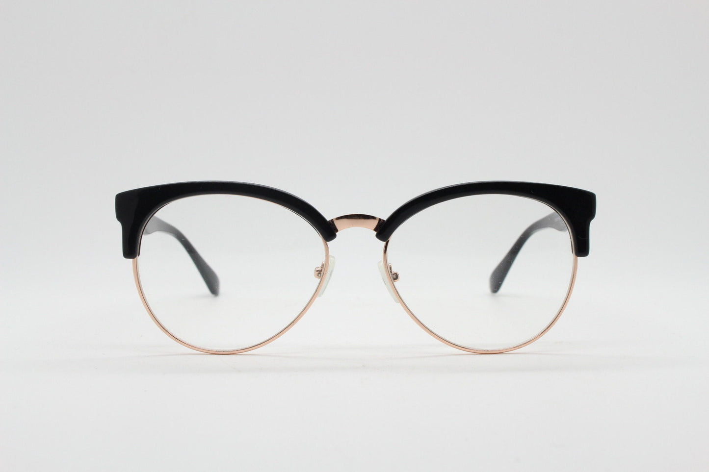 90s vintage modified cat eye glasses. Black gloss browline half frame eyeglasses with gold underwire. 50s, 60s design cateye. NOS