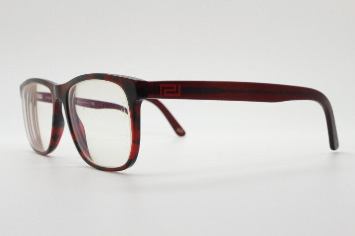 Versace modified wayfarer design eye glasses made in Italy. Mottled brown acetate optical frames with subtle logo. Prescription eyeglasses