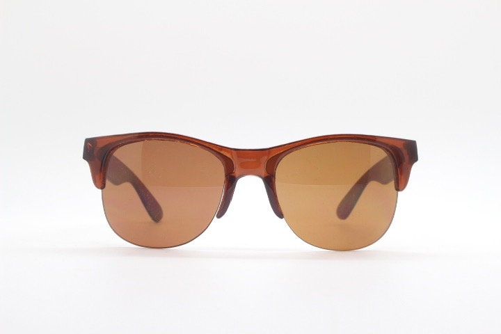 90s vintage modified wayfarer design sunglasses. Transparent brown browline half frame with brown or green interchangeable lenses . NOS