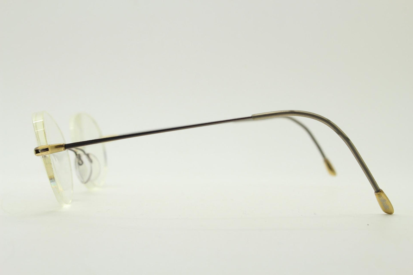 Silhouette vintage oval frameless eye glasses made in Austria. Minimal lightweight satin bronze optical frame. Prescription spectacles