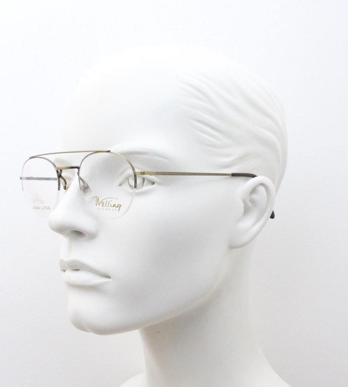 90s vintage round eye glasses made in Japan by Welling. Brushed bronze finish optical half frame. Prescription RX spectacles. NOS