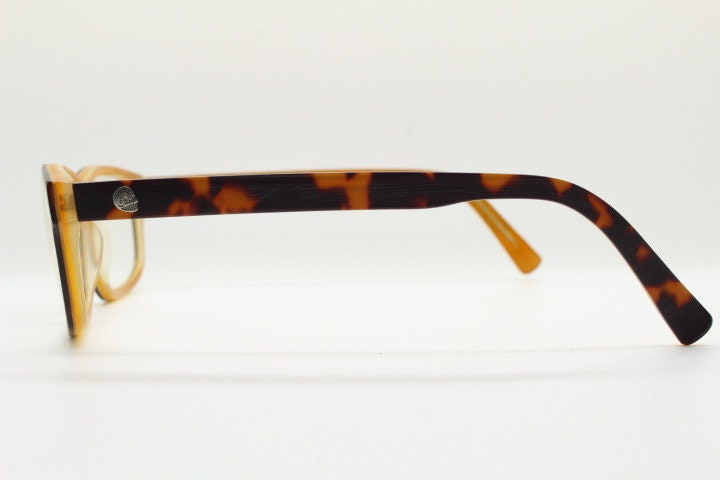 Cheap Monday rectangular low profile eye glasses. Brown and amber layered acetate optical frames. Prescription eyeglasses. RX spectacles