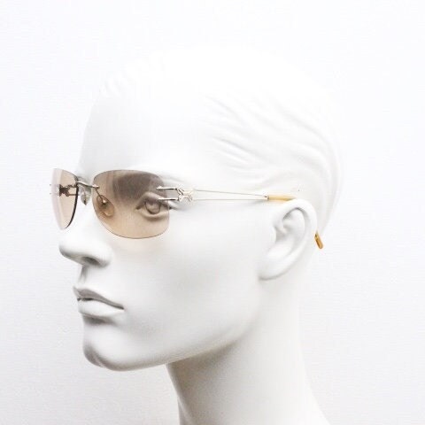 Y2K vintage rimless rectangular sunglasses. Frameless 2000's brown lens with slight mirror glaze gold trim and butterfly hinges. 00's NOS