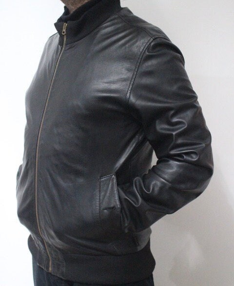 Paul Smith high collar bomber jacket. Plain black lambskin minimal flap pocket mens zipper. Ribbed collar. Size Medium