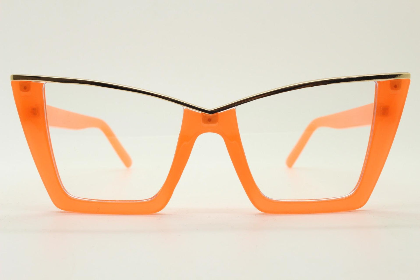 Dynamic pointed cat eye glasses. Transparent thick orange optical frame with gold metal 'owl' brow. and clear lenses. Vintage. Prescription