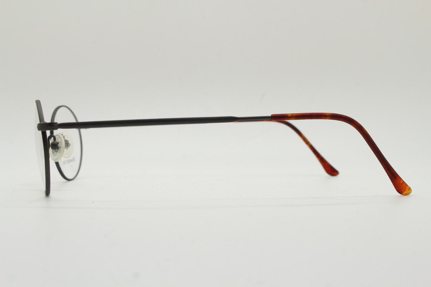 Eddie Bauer 90s vintage oval eye glasses. Minimal black matt finish optical frames with kinked arms. Stainless steel spectacles. NOS