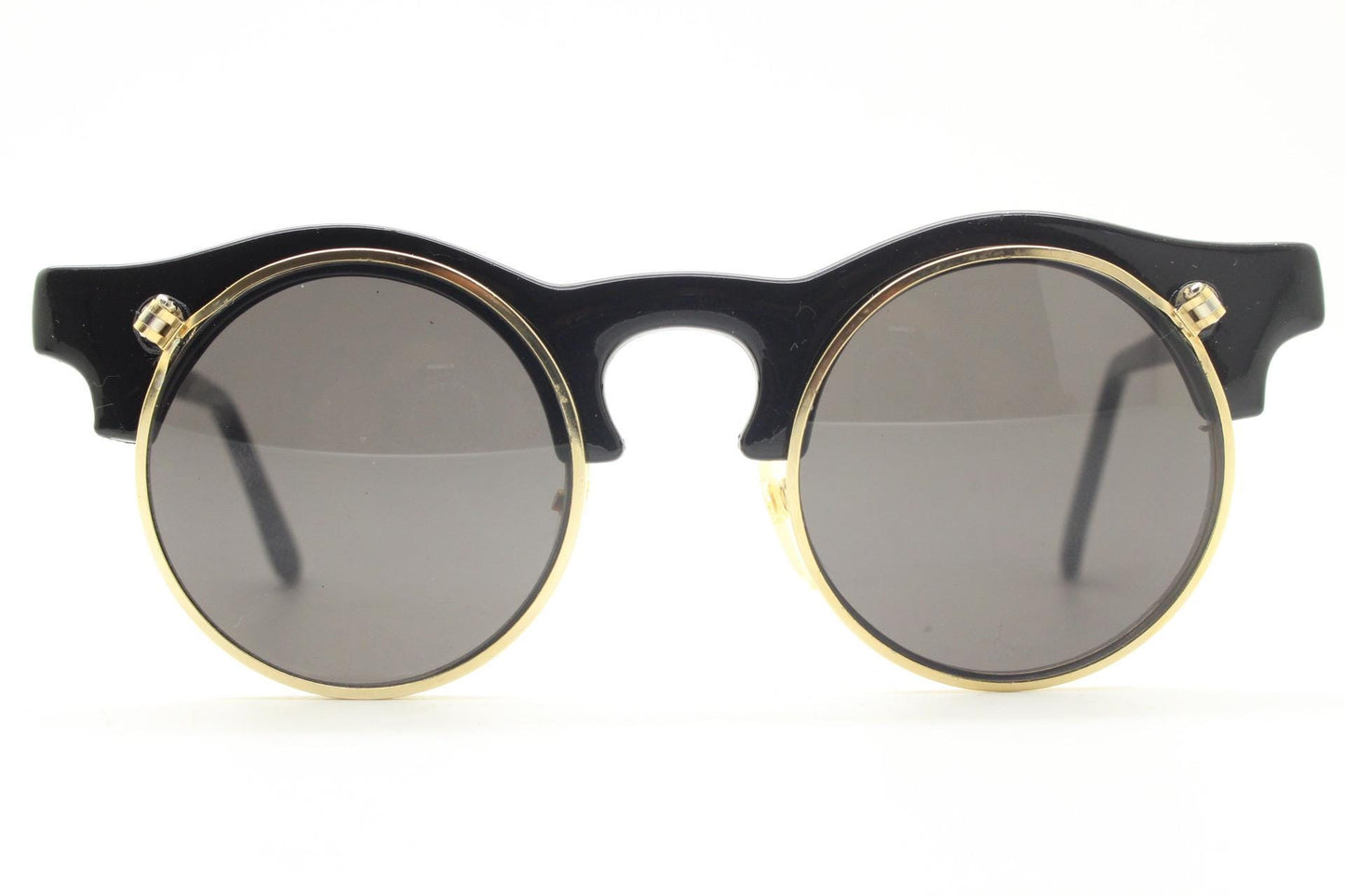 Vintage 80s round flipper sunglasses. Black gloss frame with clear lenses and incredible side flip up shades . BNWT unused NOS