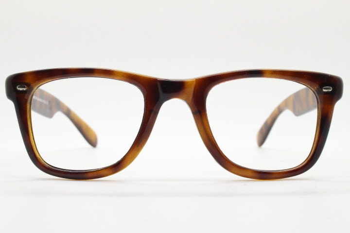 90s vintage wayfarer design eye glasses made in Italy. All time classic optical frames in mottled browns. Prescription RX eyeglasses. NOS