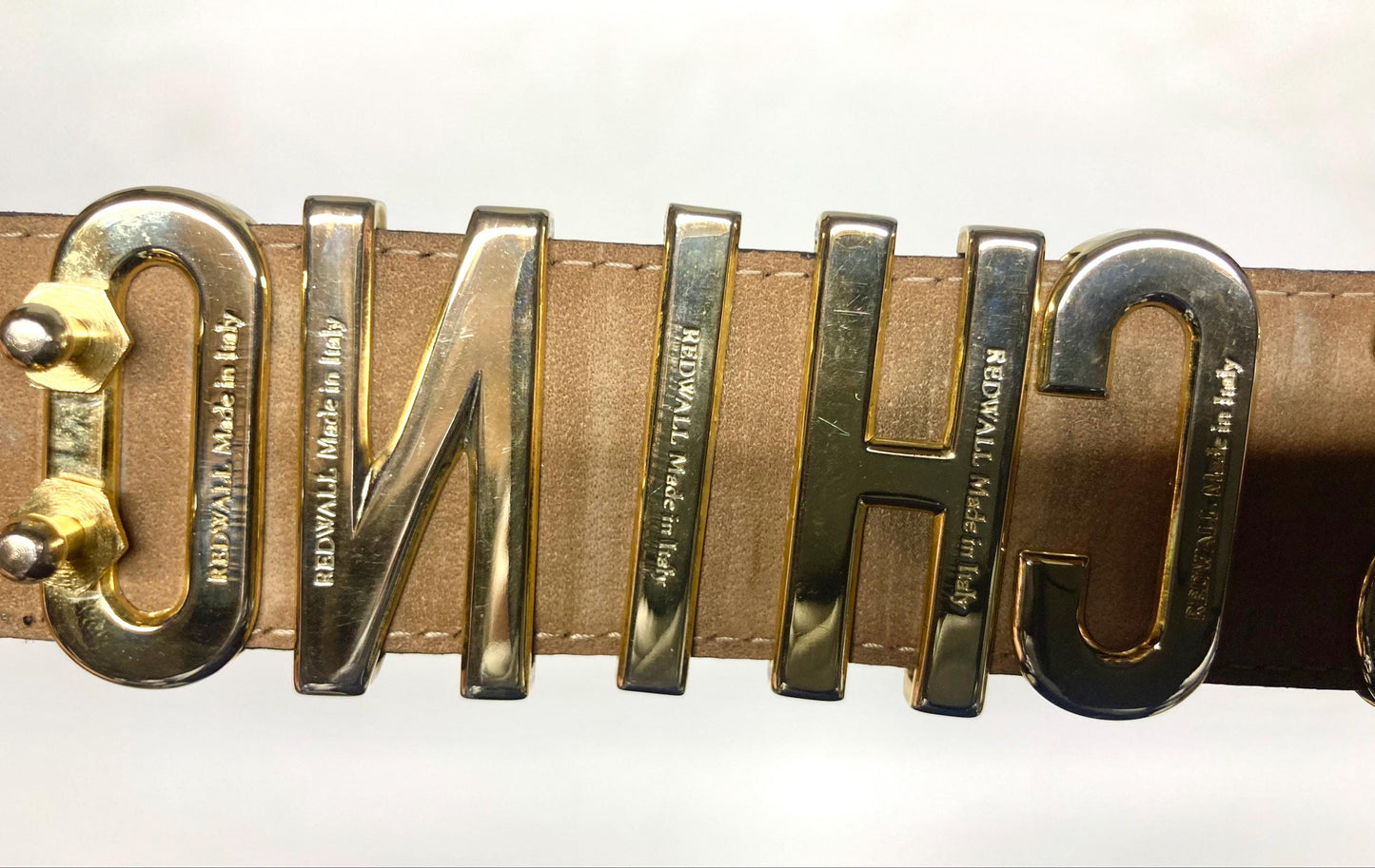 Moschino 90s vintage womens dress belt in black genuine leather. Iconic individual golden moving letters logo. Made in Italy. 80s. NOS
