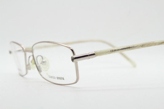 Giorgio Armani 90s vintage oval eye glasses made in Italy. Gold front with marbled white acetate arms. Optical frames. Prescription RX