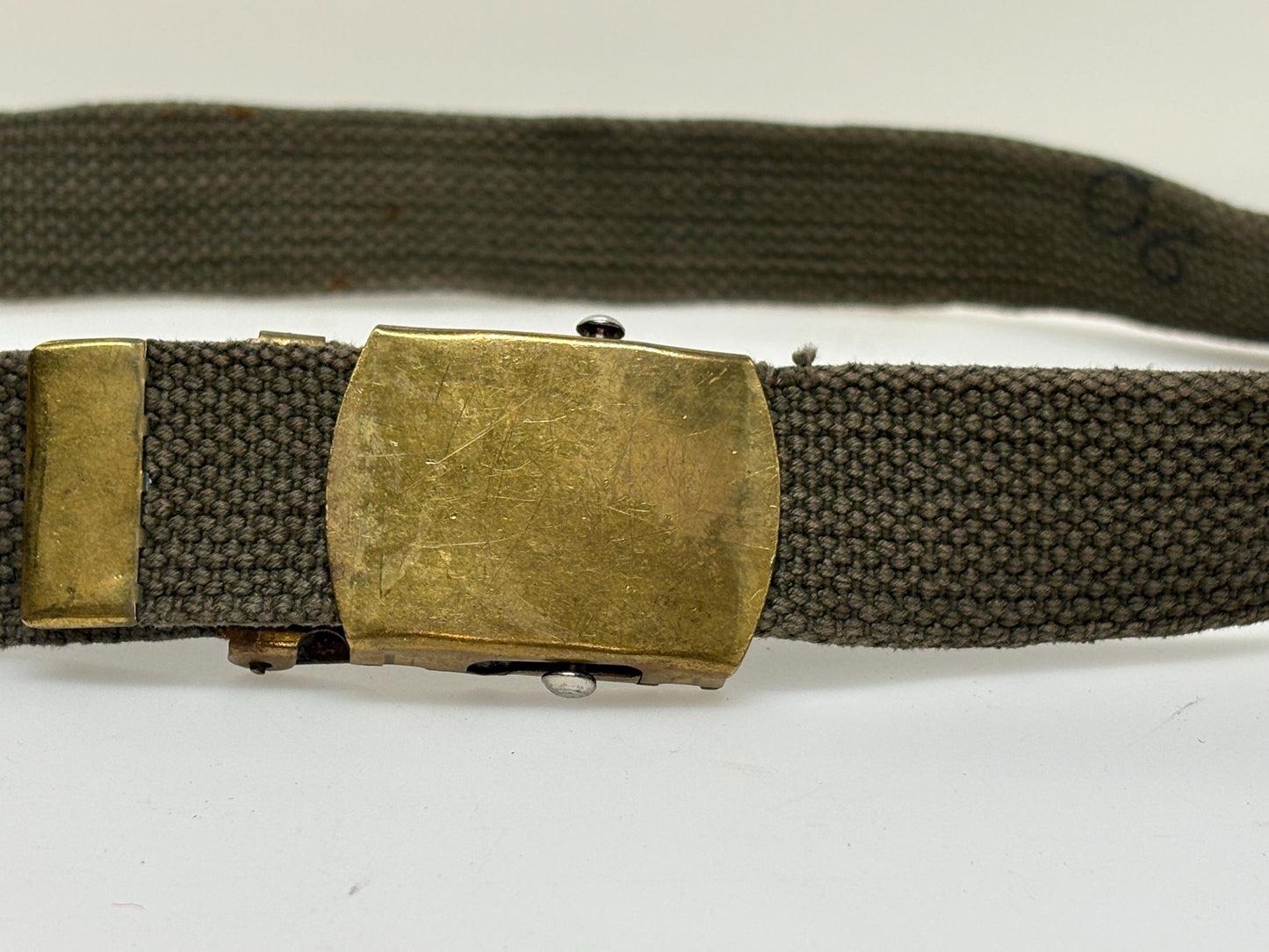 2 x bundle 80s vintage canvas army belts. One black plus one khaki green no holes format. Slide lock gold buckle. Webbing. Fully adjustable