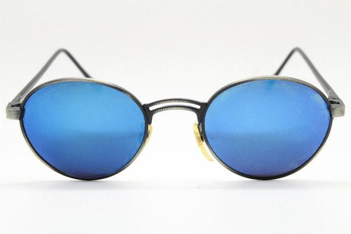 90s vintage oval panto sunglasses. Brushed bronze metal frame with cool blue mirror lenses and black slender arms. Unused NOS