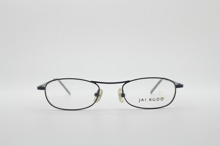 Jai Kudo 90s vintage oval eye glasses. Small low profile optical frames in charcoal grey chrome. Prescription eyeglasses. RX Spectacles