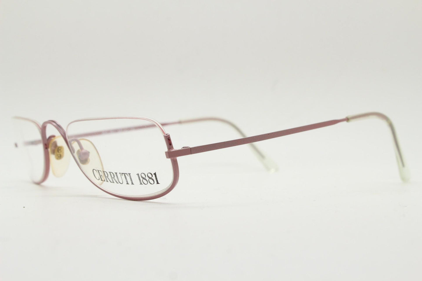 Cerruti 1881 half moon eye glasses. Pink half frame optical eyeglasses. Undulating C bridge design. 90s vintage prescription spectacles. NOS