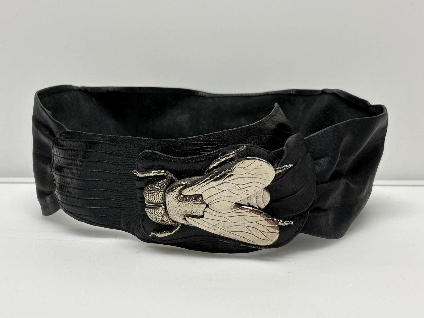80s vintage womens black real leather dress belt with substantial dramatic big fly metal buckle. Womens sash. Statement feature belt