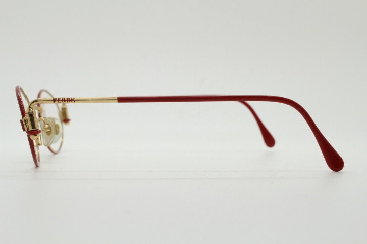 Gianfranco Ferre 90s vintage oval eye glasses made in Italy. Red and gold metal tech design optical frame. Prescription RX. NOS