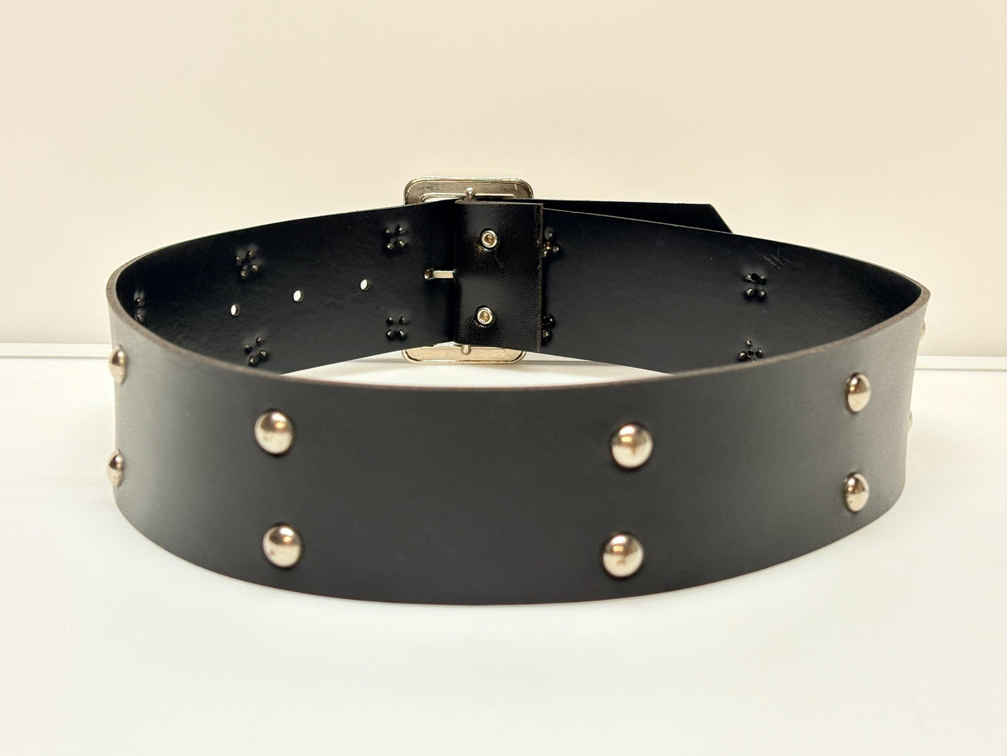 Y2k vintage womens dress belt with flat silver buckle and 2 rows of round domed metal studs. Thick black vinyl 2000s NOS