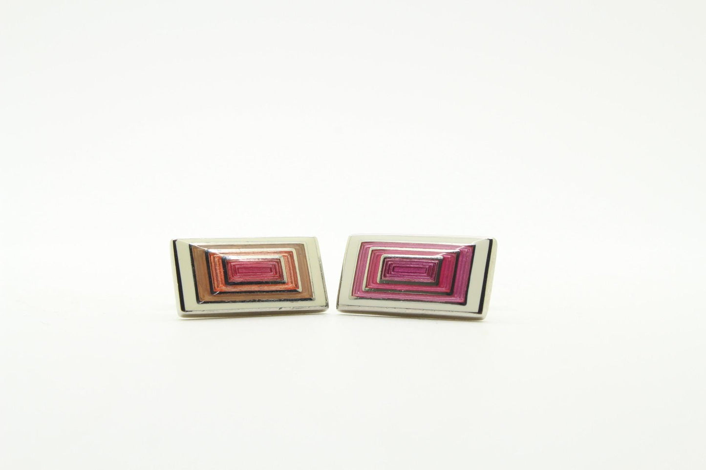 Vintage rectangular cuff links made in England by Herringbone. Solid metal construction with fine enamelled white, pink and peach tones. NOS