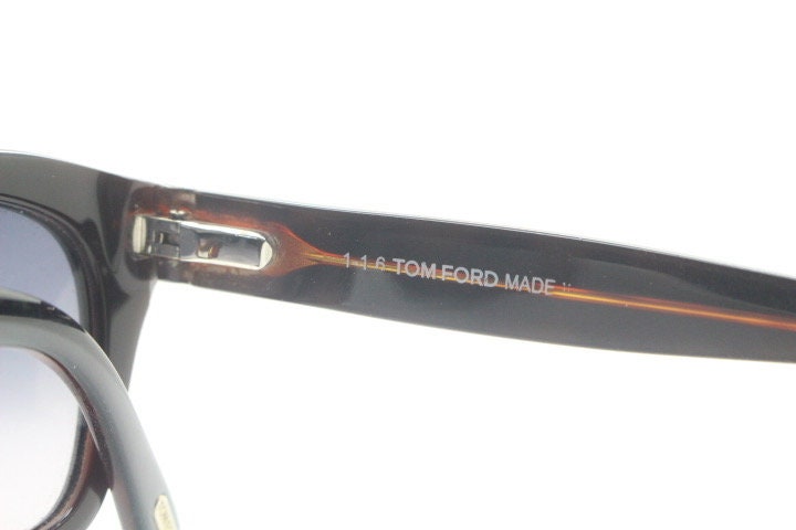 Tom Ford vintage modified wayfarer sunglasses made in Italy. Slightly cat eye form in black gloss acetate with superb graduating lenses