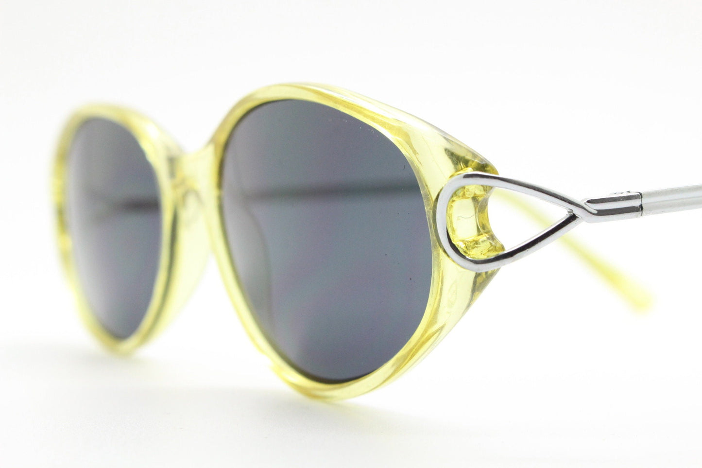 Carven Paris 90s vintage oval sunglasses. Womens transparent yellow frame with black lenses and silver metal arms. NOS