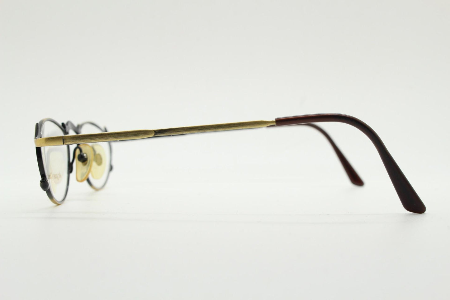 90s vintage oval eye glasses by Argus Chassis. Brushed bronze optical frames with dynamic spikes. Prescription cosplay fetish spectacles NOS