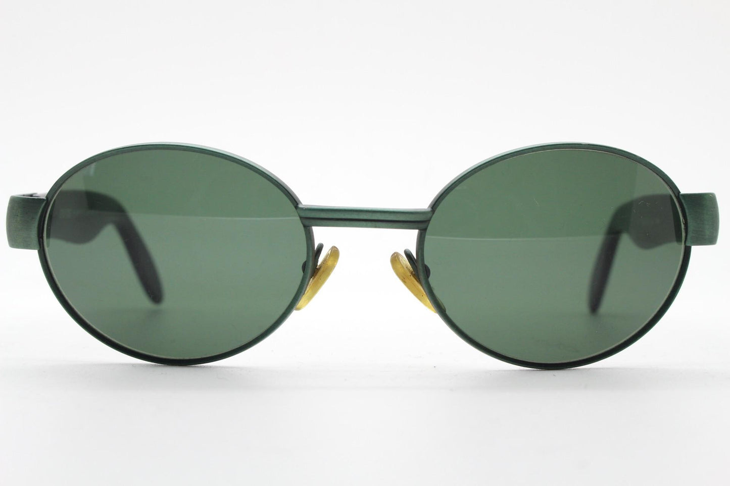 Safilo for Oxydo 90s vintage oval sunglasses made in Italy. Green matt finish solid metal frame with black arms and green lenses. Unused NOS