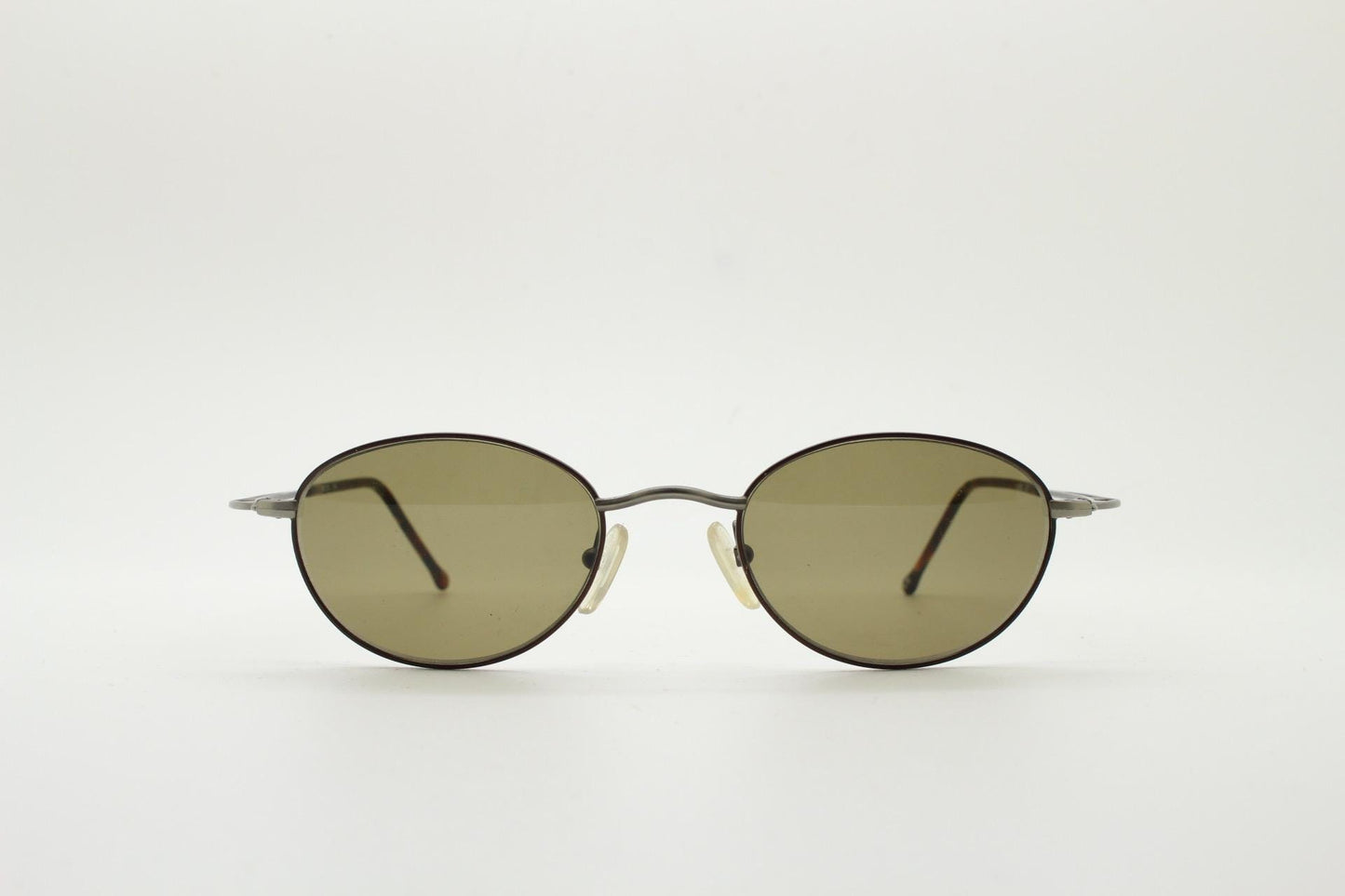 90s oval vintage metal sunglasses. Minimal satin finish bronze and brown metal frame with kinked curving arms. Steampunk. Unused NOS