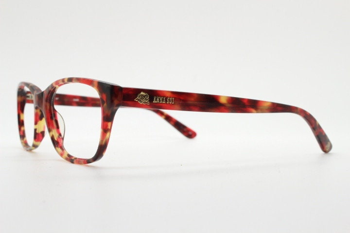 Anna Sui modified wayfarer design eye glasses. Superb marbled acetate optical frames with red tones. Prescription RX vintage eyeglasses