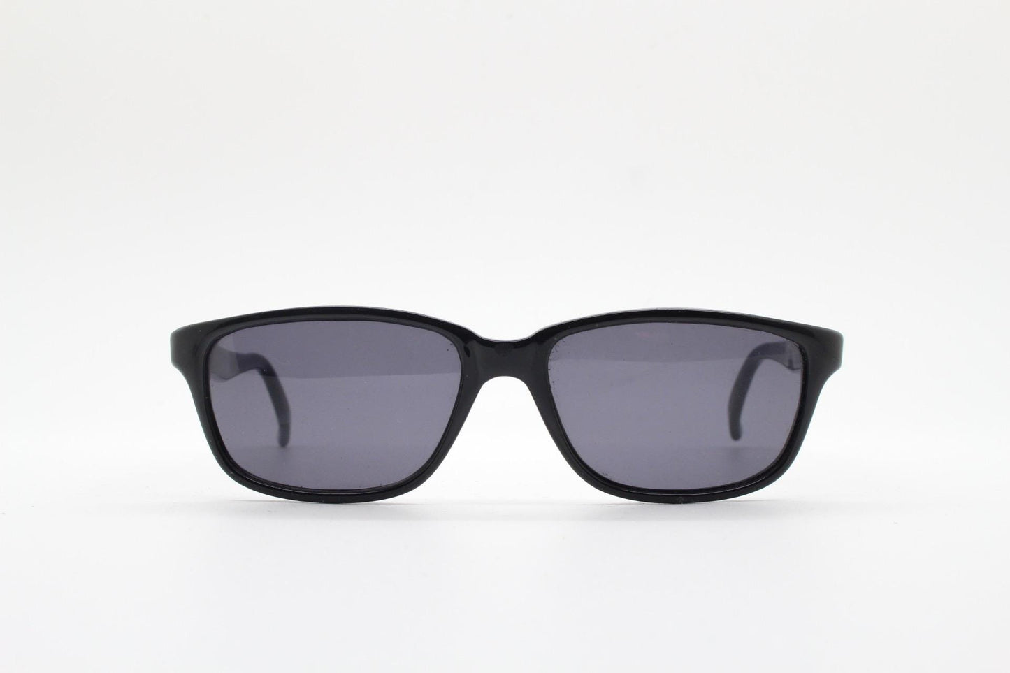 Vintage 90s slim rectangular modified wayfarer design sunglasses made in Italy. All black gloss low profile acetate frame. Unused NOS
