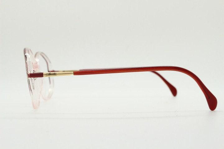 Silhouette 80s vintage hexagon eye glasses made in Austria. Transparent crystal optical frame with abstract red pattern. Prescription RX