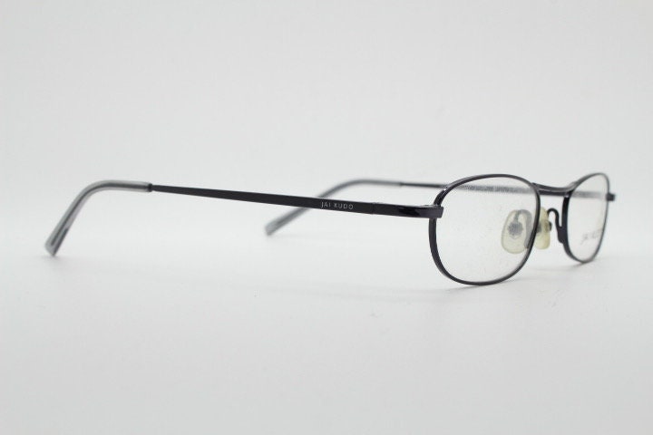 Jai Kudo 90s vintage oval eye glasses. Small low profile optical frames in charcoal grey chrome. Prescription eyeglasses. RX Spectacles