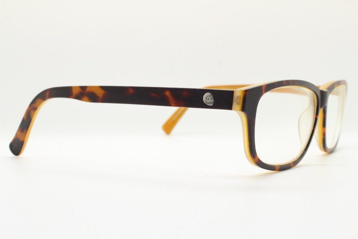 Cheap Monday rectangular low profile eye glasses. Brown and amber layered acetate optical frames. Prescription eyeglasses. RX spectacles