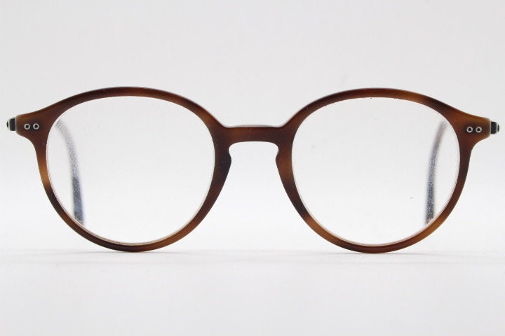 Giorgio Armani eye glasses model 7124 made in Italy. Mottled brown acetate optical frames with flat metal arms. Prescription eyeglasses. RX