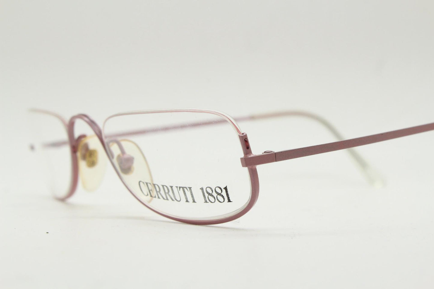Cerruti 1881 half moon eye glasses. Pink half frame optical eyeglasses. Undulating C bridge design. 90s vintage prescription spectacles. NOS