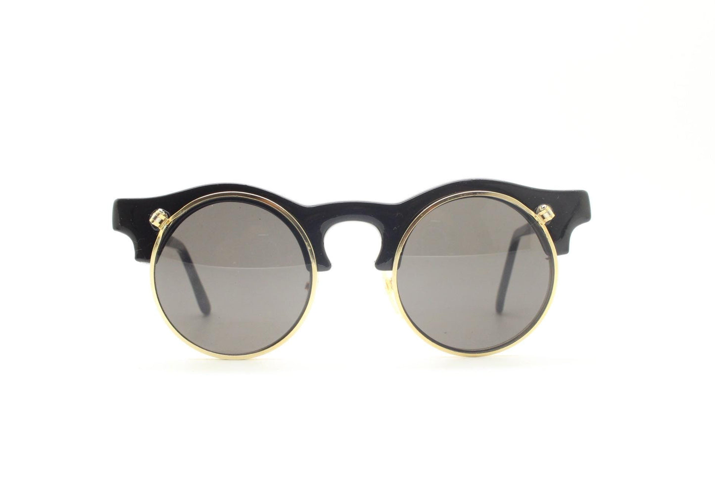 Vintage 80s round flipper sunglasses. Black gloss frame with clear lenses and incredible side flip up shades . BNWT unused NOS