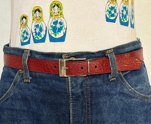 80s vintage womens embossed crocodile pattern 1" belt for jeans or trousers. Eco leather red vinyl with silver chrome buckle. Vegan
