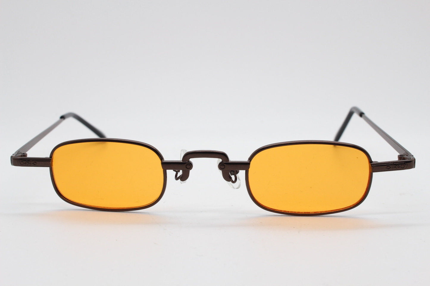 90s vintage small rectangular sunglasses. Imposing minimal bronze brown metal victorian style frame with orange lenses. Steampunk. BNWT