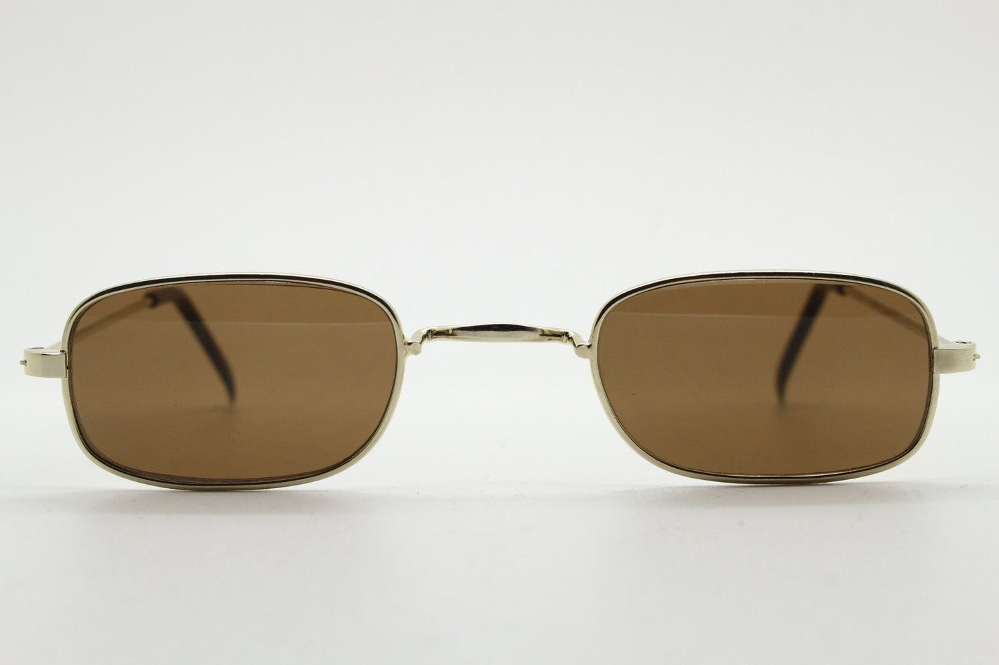 80s vintage rectangular low profile metal sunglasses. Minimal 60s mens mod design in gold chrome frame with brown lenses. NOS