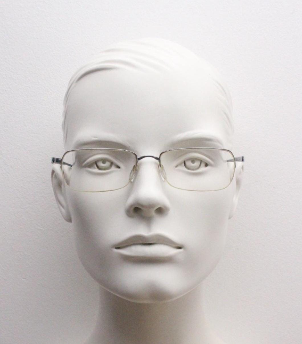 Silhouette rectangular half frame eye glasses made in Austria. Minimal brow line optical frame with patterned transparent arms. Prescription