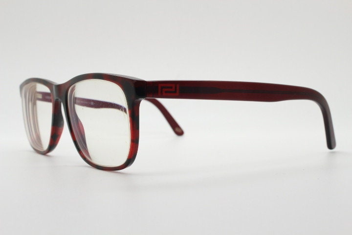 Versace modified wayfarer design eye glasses made in Italy. Mottled brown acetate optical frames with subtle logo. Prescription eyeglasses