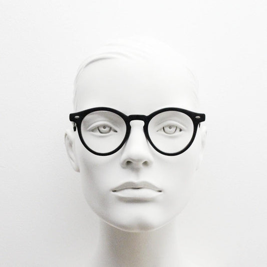 Oliver Smith round eye glasses. Black matt finish optical frames with protruding corners and keyhole bridge. Prescription RX eyeglasses