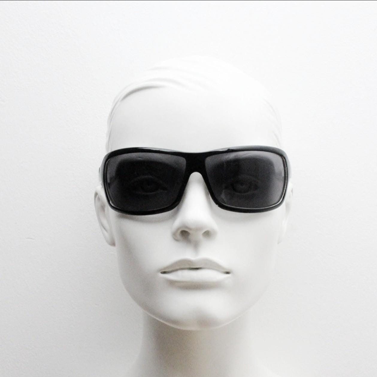 Y2k vintage wrap around large square sunglasses. Curved black shield frame with tasteful striped interior. 1960s bug eye design. 2000's NOS