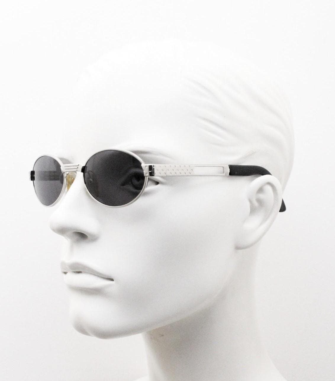 Prestige 90s vintage oval small bug eye sunglasses model 4028 made in Italy. Chrome finish solid metal frame with indented arm pattern. NOS