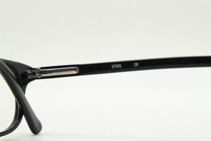 Sting 90s vintage rectangular eye glasses made in Italy. Plain black gloss low profile acetate optical frames. Prescription RX. NOS