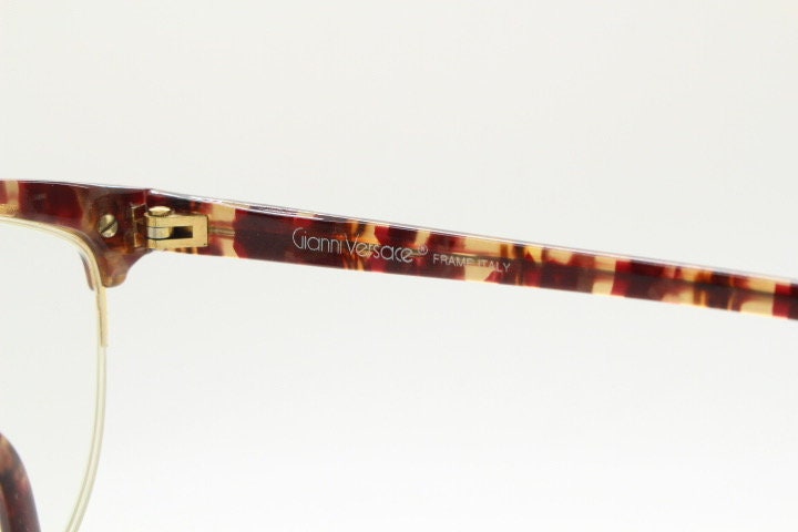 Versace 90s vintage brow line cat eye glasses made in Italy. Elegant tortoise acetate cateye optical half frames. Prescription RX eyeglasses