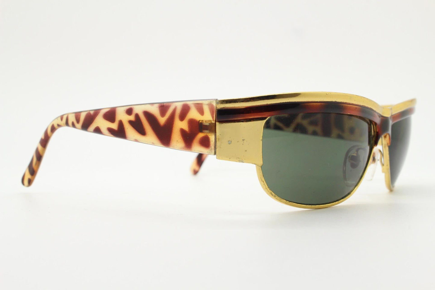 90s vintage visor shield sunglasses. Substantial metal curved wraparound frame with metallic tiger brow and abstract arm patterns. NOS. BNWT