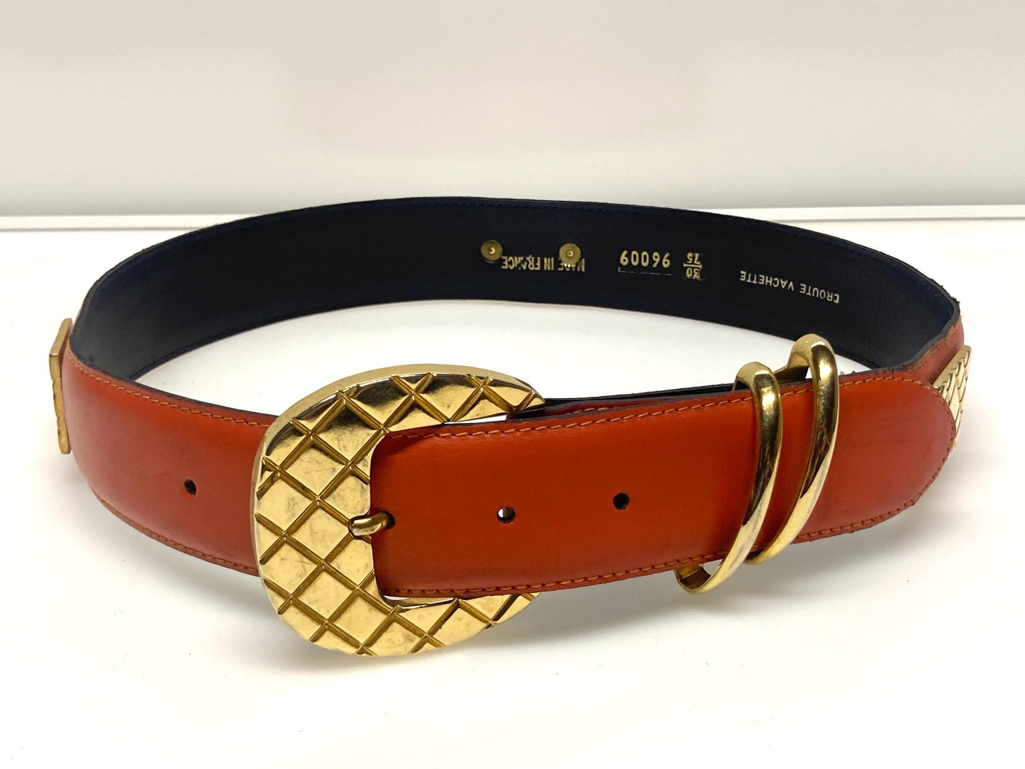 80s vintage womens dress / jeans belt in bright orange leather with golden metal squares. Made in France. Used in good condition