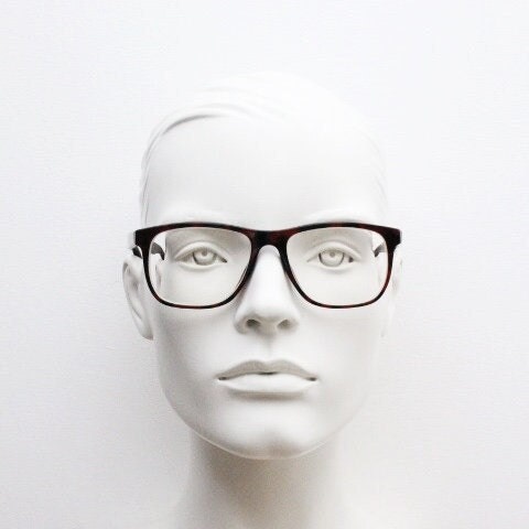 Versace modified wayfarer design eye glasses made in Italy. Mottled brown acetate optical frames with subtle logo. Prescription eyeglasses