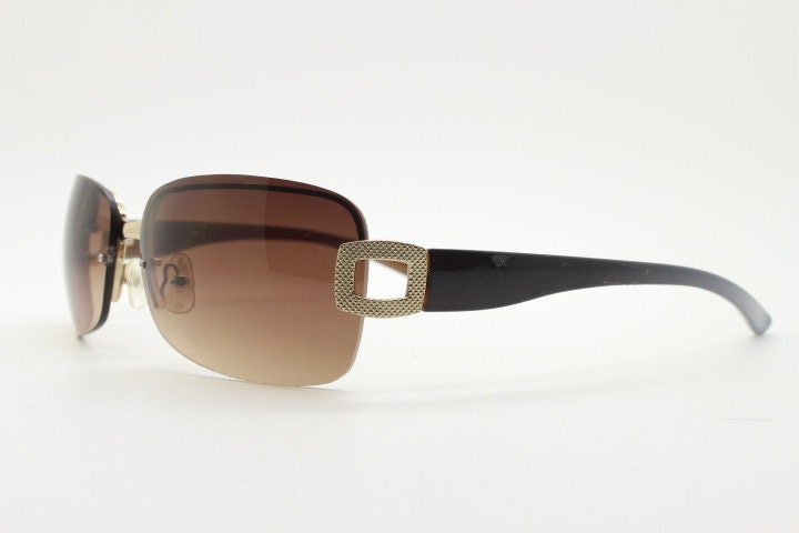 Y2K vintage rectangular brown sunglasses. Gold half frame 2000's wrap around with curved lenses, gold trim and temple crests. Unused NOS