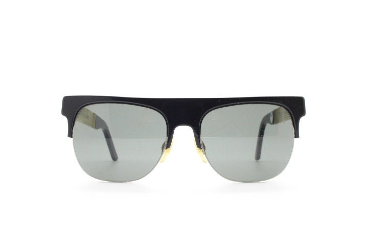 Retrosuperfuture vintage flat top half frame sunglasses hand made in Italy. Black gloss acetate front with tall golden arms
